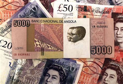 angola currency to gbp